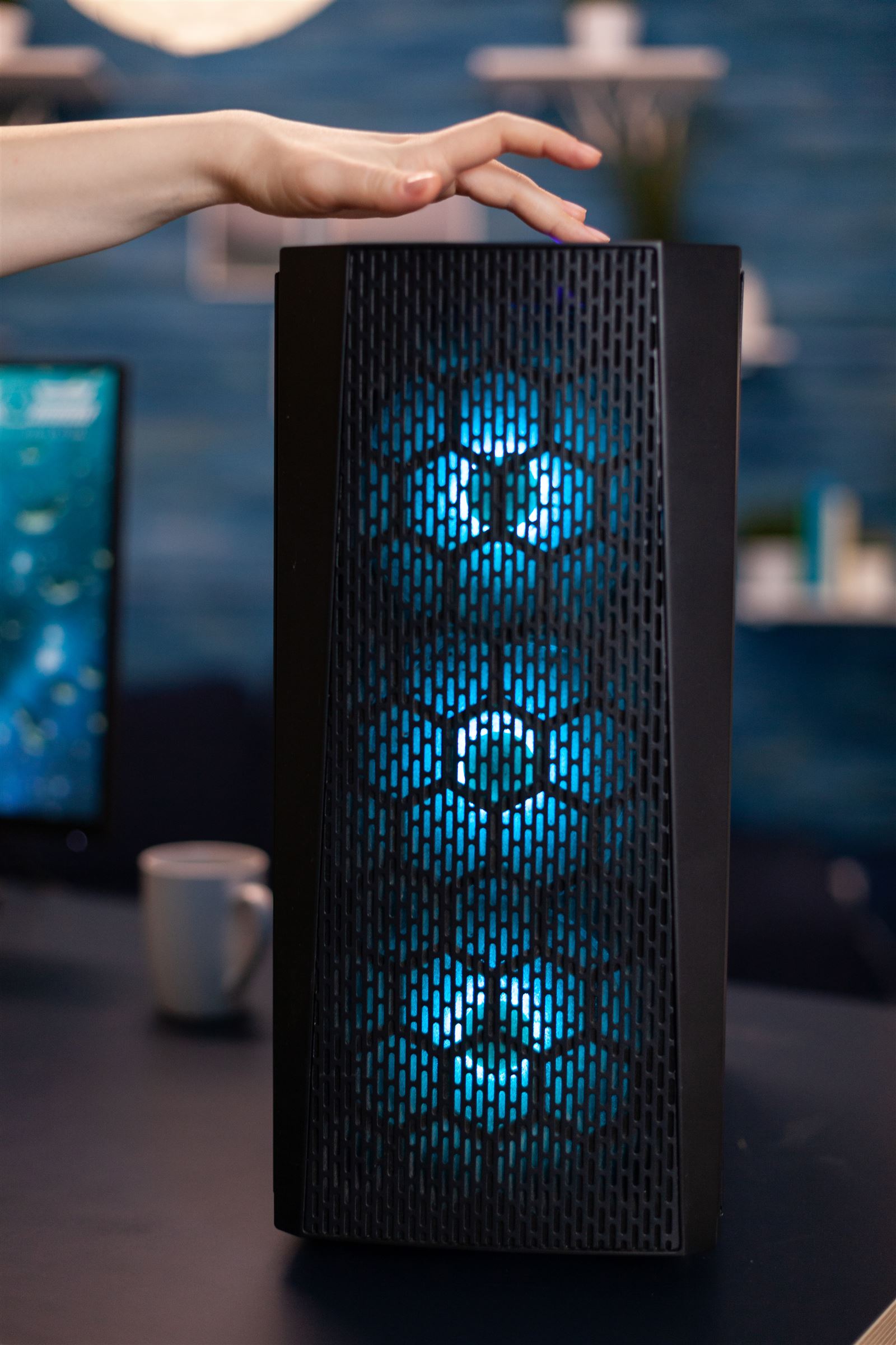 Custom gaming PC with blue RGB fans on a desk